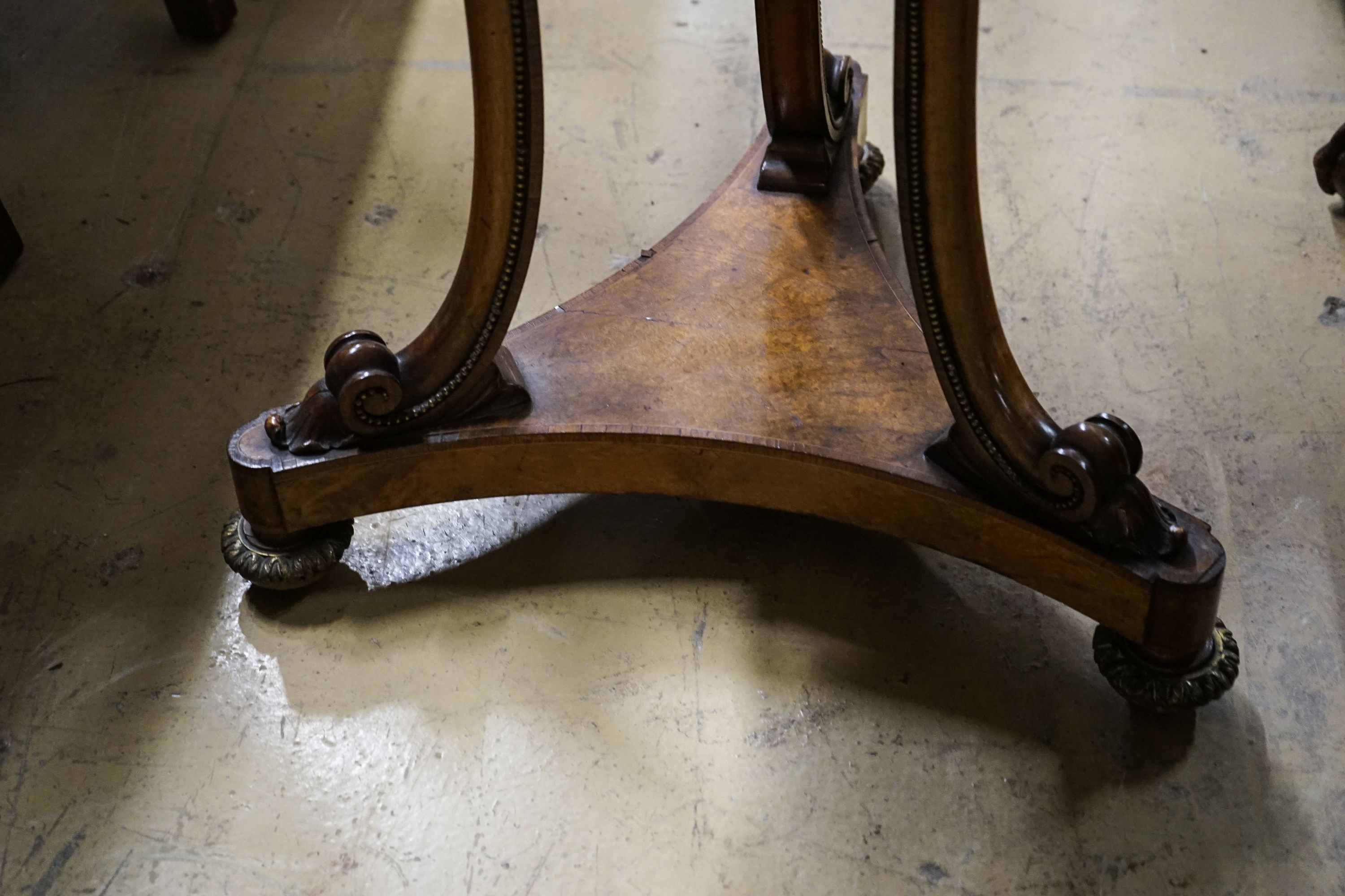 A Victorian gilt metal mounted walnut circular marble top table, diameter 60cm, height 73cm